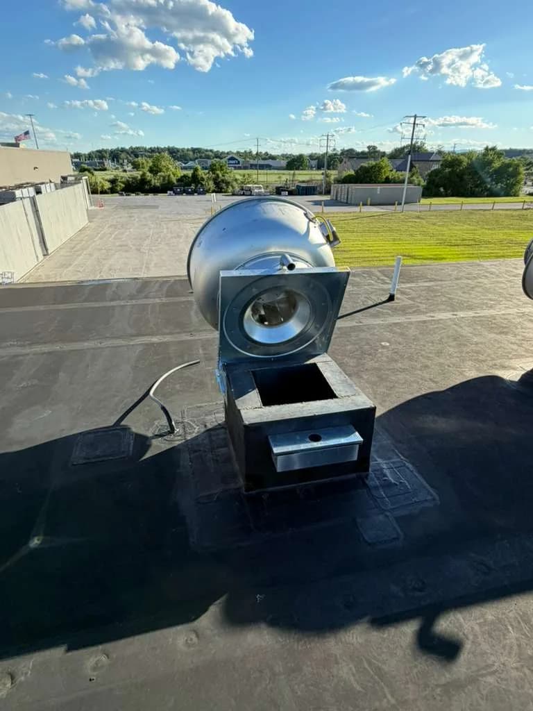 CaptiveAire rooftop exhaust fan opened for maintenance and inspection